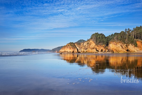 View from Hug Point north to Cannon Beach and Haystack Rock at low tide on a Winter afternoon