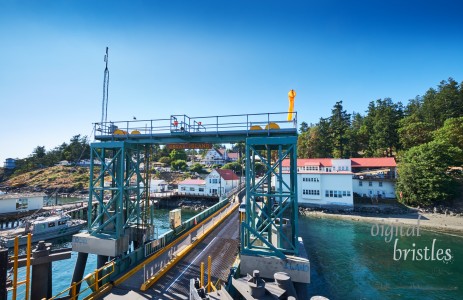Orcas Island ferry terminal with car loading ramp on a sunny summer afternoon