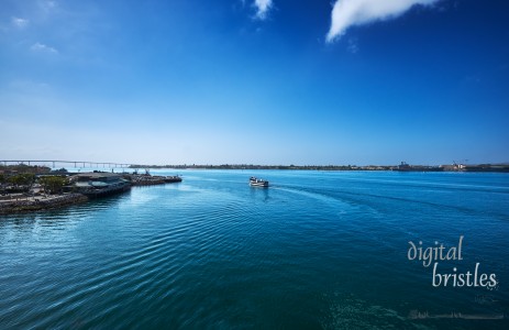 View South in San Diego Bay with a mix of tourist boats and naval ships