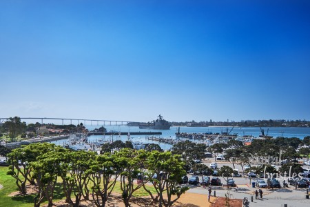 Naval Supply Ship moving past Seaport Village in San Diego Bay