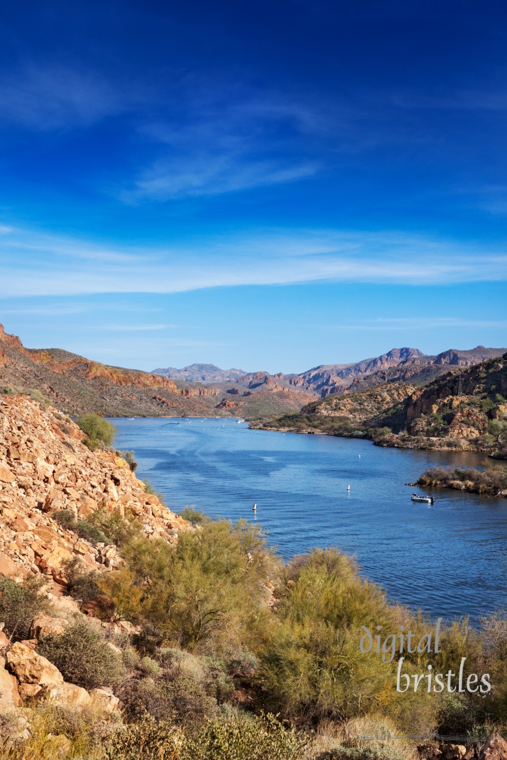 View of Canyon Lake from the Apache Trail looking down to the marina and mountains beyond