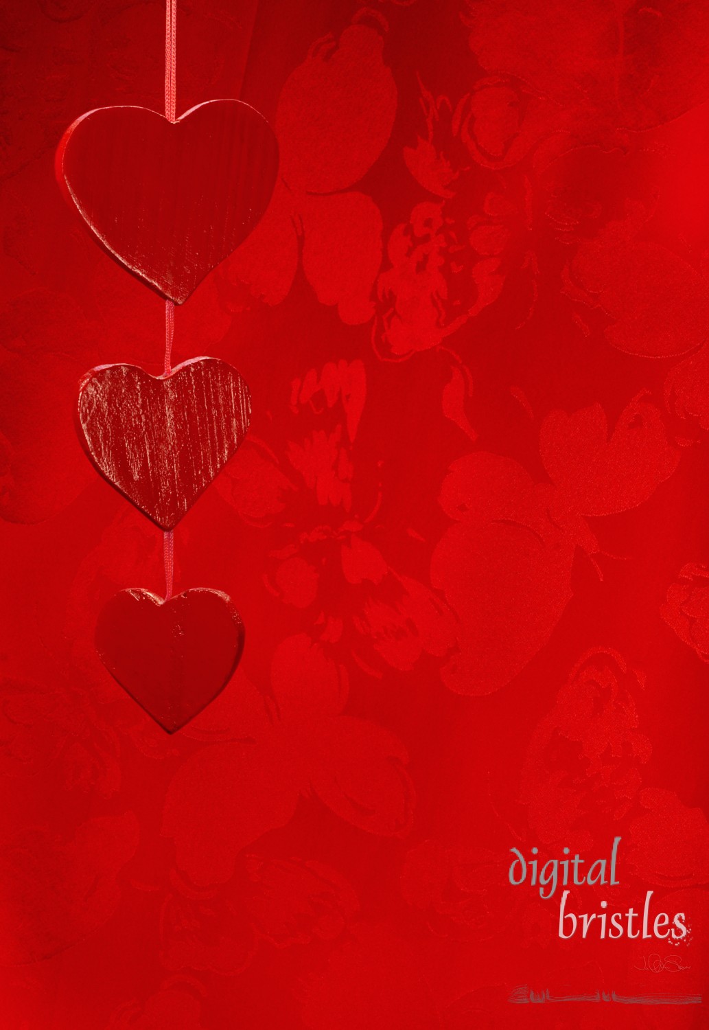 Painted red wooden hearts with red silk background