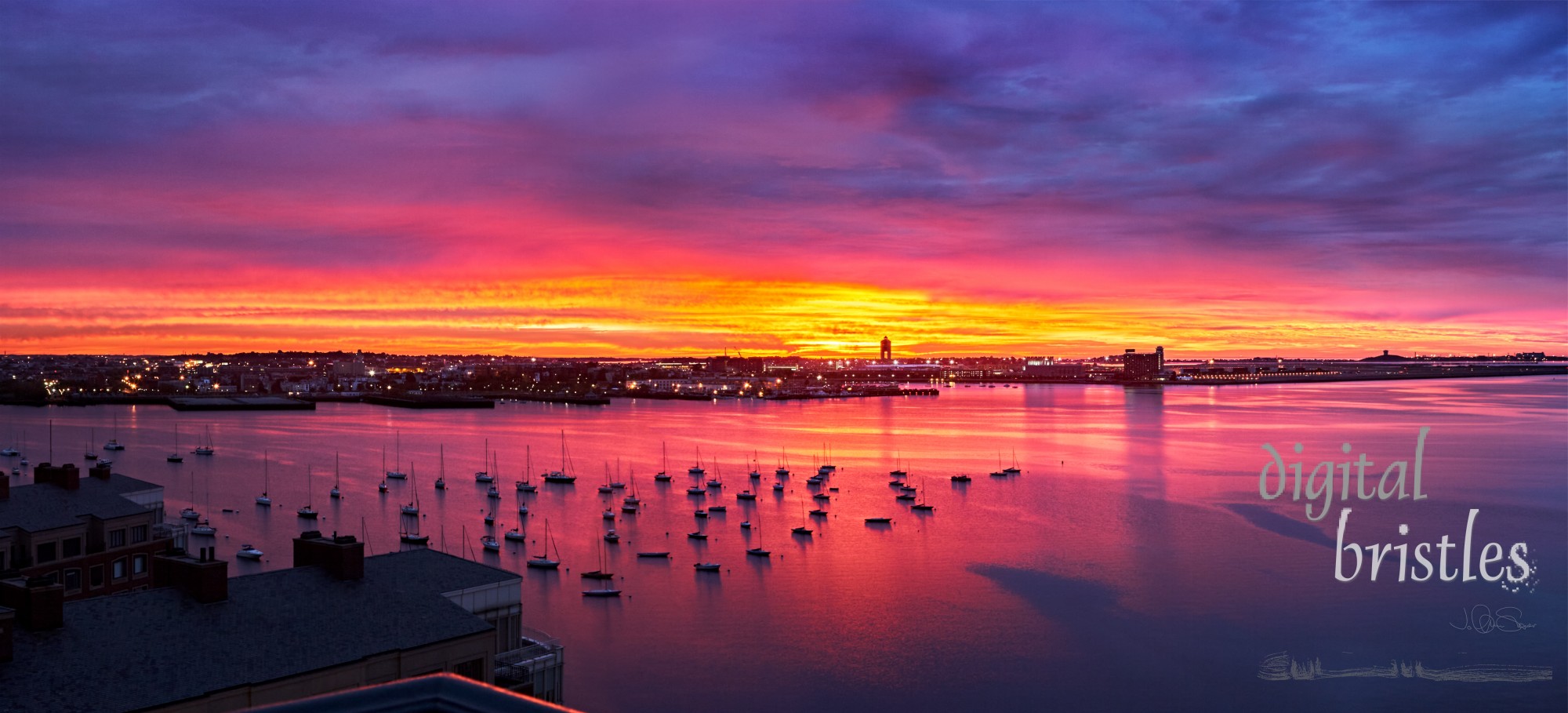 Bustling East Boston, Logan airport and boats at anchor in Boston Harbor on a summer morning