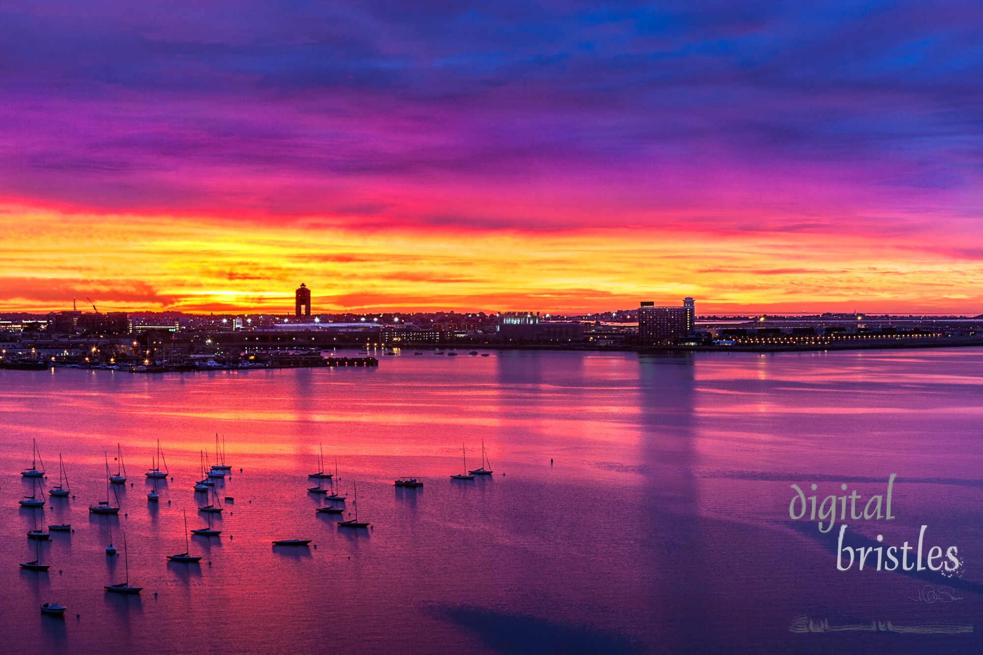 Vivid skies before sunrise with boats at anchor in the harbor 