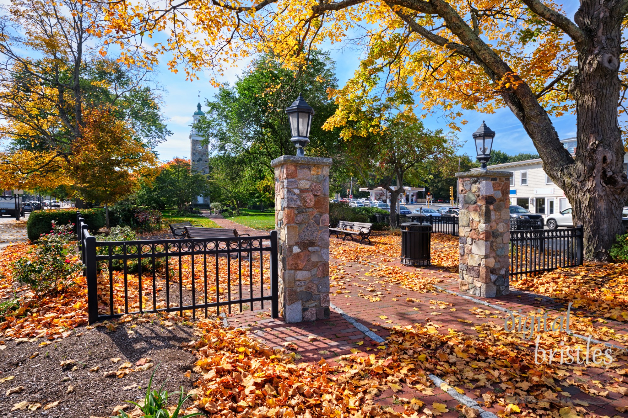 Autumn oranges and yellows decorate the entrance to Elm Park, Wellesley, Massachusetts