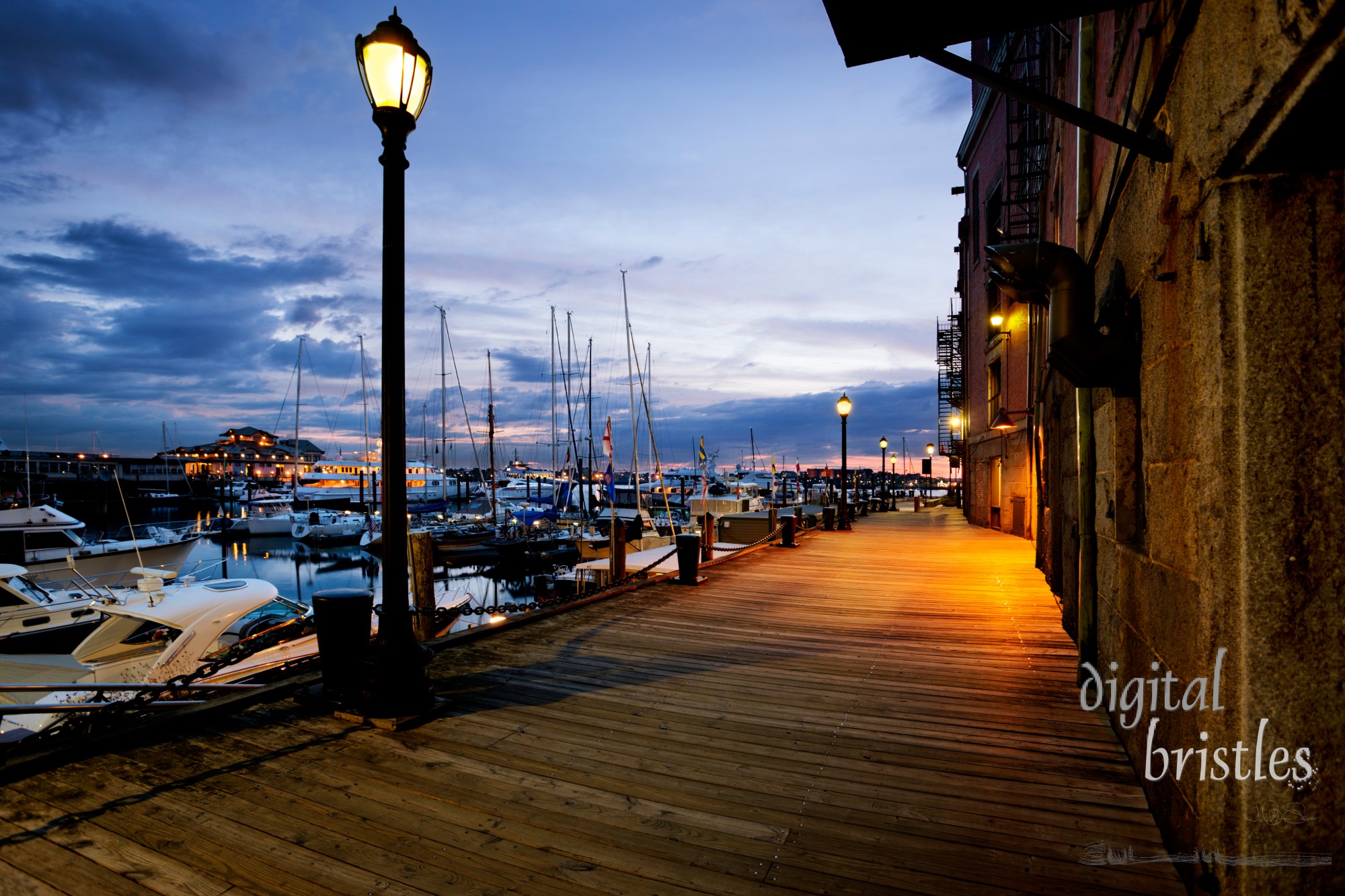 Pre-dawn light on the Boston harbor walk by Long Wharf