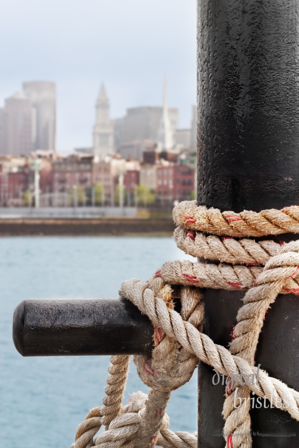 Heavy ropes secure a ship on the Charlestown side of Boston Harbor