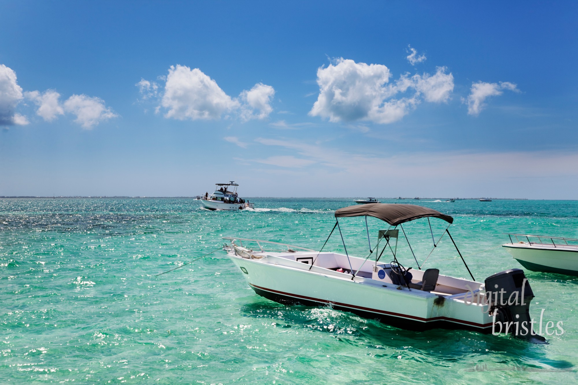 Boats anchored by the sandbar at Stringray City, Grand Cayman