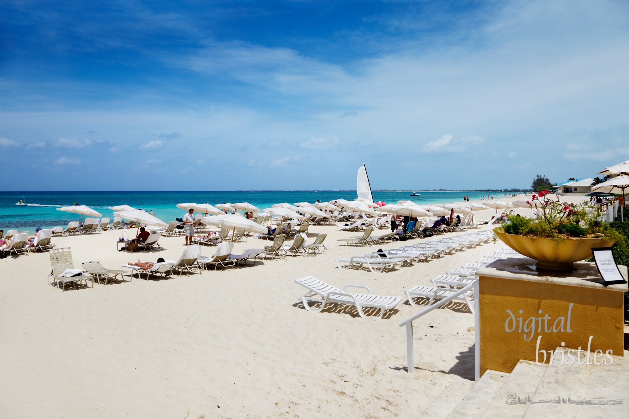 People busy relaxing on Seven Mile Beach, Grand Cayman