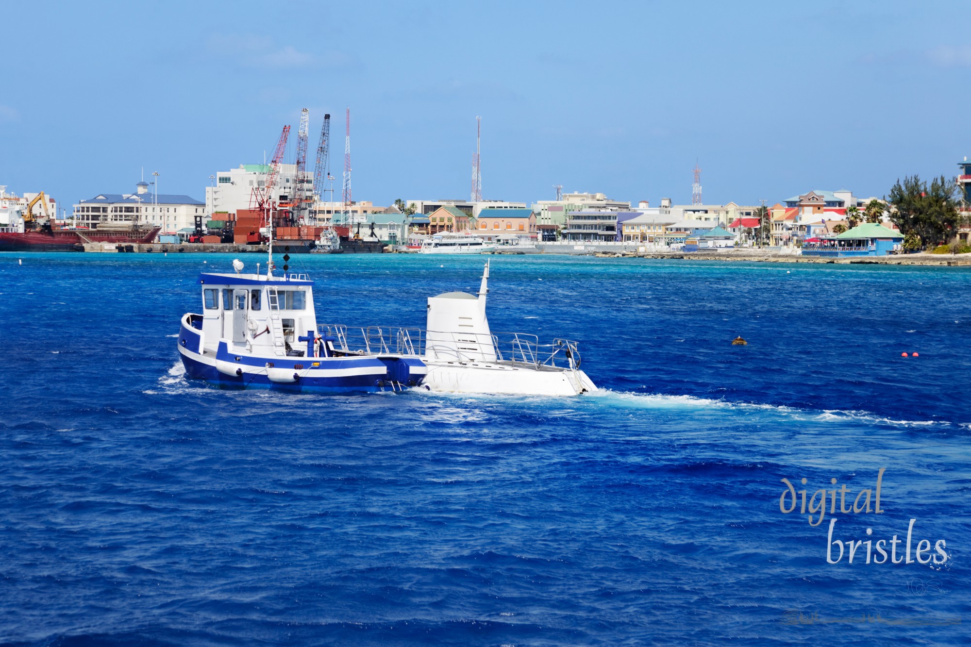 Small tugboat escorting a submarine through Georgetown harbor