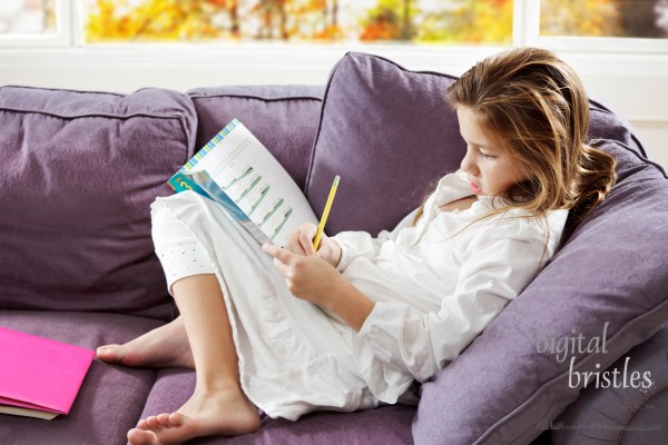 Young girl works on her math problems