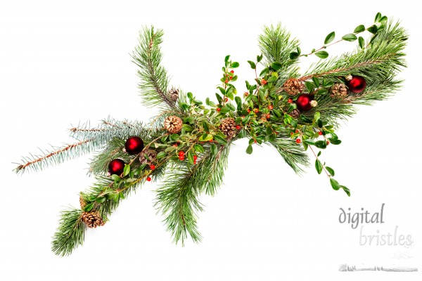 Holiday garland with ornaments, pine & spruce branches, pine cones and evergreen with berries (Common Bearberry/Kinnikinnick). Shot straight down but at an angle to get maximum length in frame.