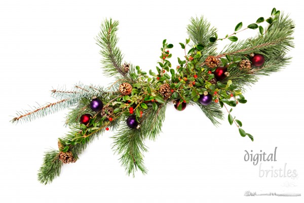 Holiday garland with ornaments, pine & spruce branches, pine cones and evergreen with berries (Common Bearberry/Kinnikinnick) Shot straight down but at an angle to get maximum length in frame.