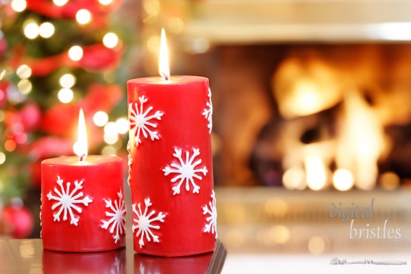 Christmas candles by the Christmas trees and fire