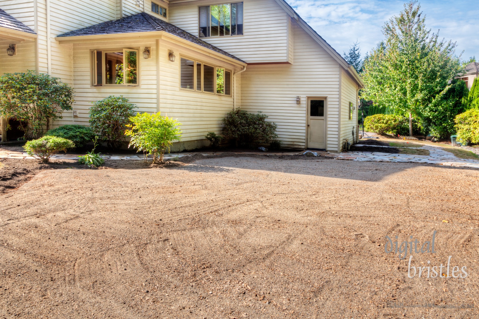 Dirt smoothed and leveled in preparation for laying stone patio