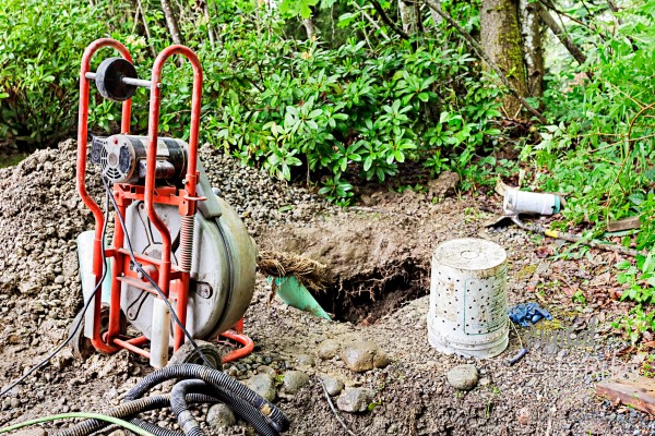 Removing tree roots from groundwater drainage pipe in a back yard
