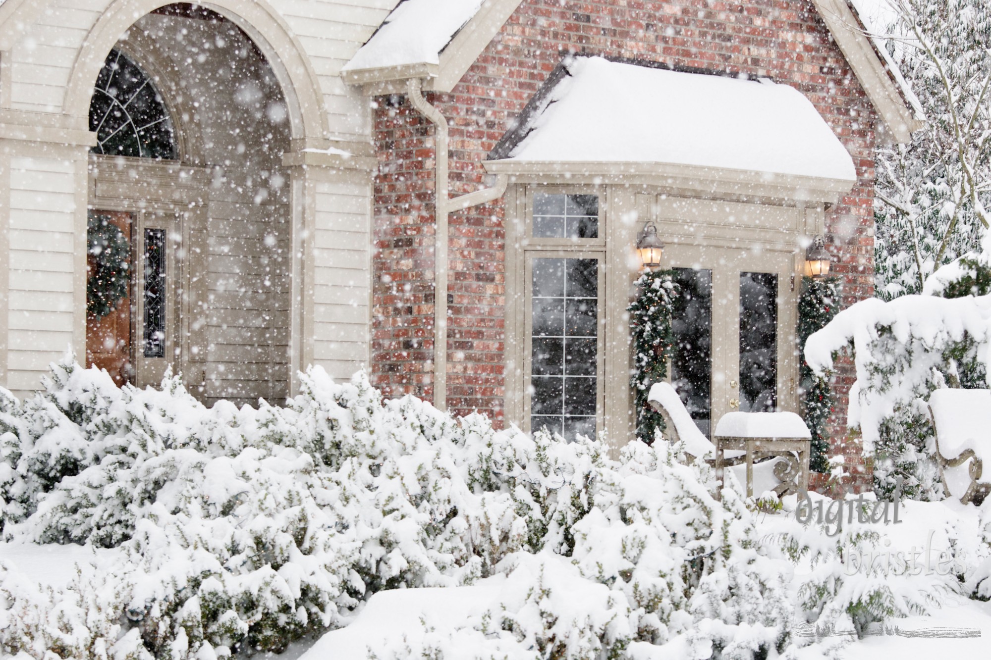 Front of suburban home in a snow storm