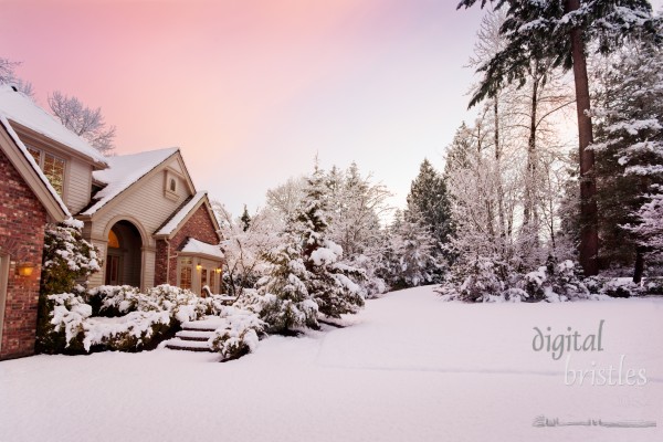 Last burst of color as light fades and night falls on a snowy suburban home