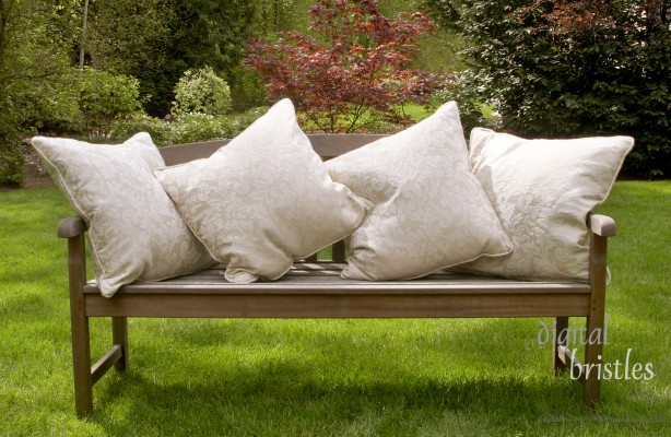 Wood garden bench with cushions