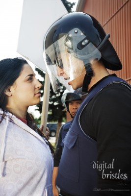 Protester and police officer make prolonged eye contact