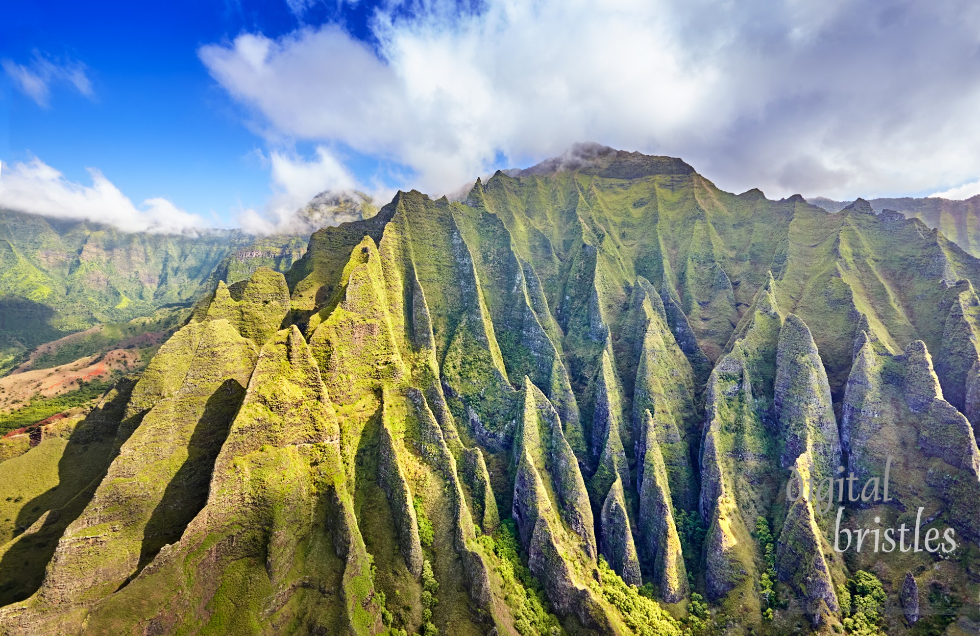 Deeply etched cliffs along Kauai's Na Pali Coast on a sunny Spring afternoon