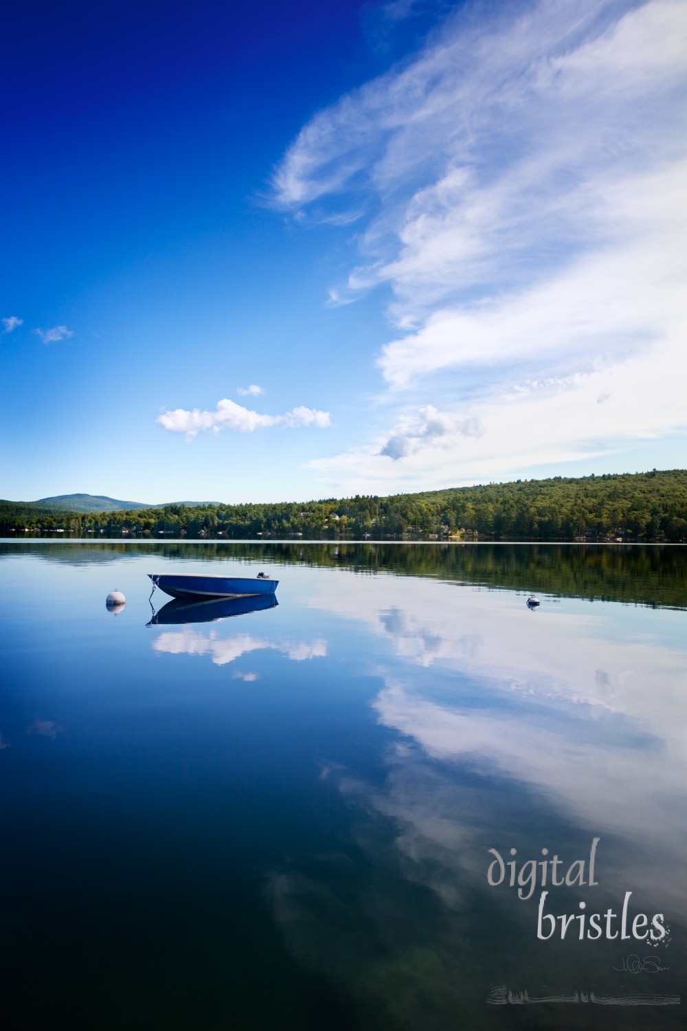 Calm New Hampshire lake on a summer morning