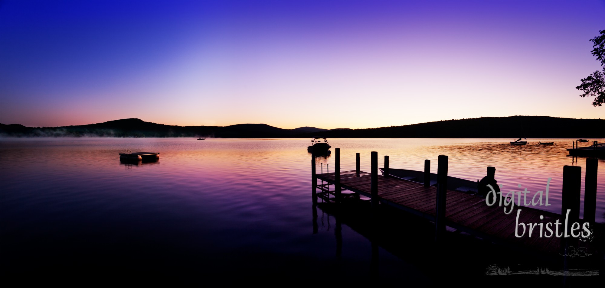 Vivid pre-sunrise colors over  New Hampshire dock and lake on a summer morning