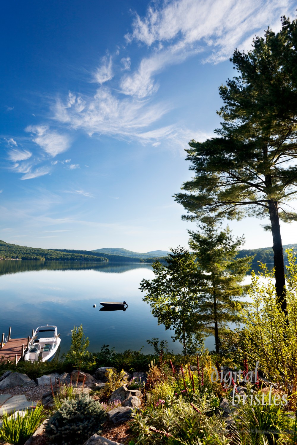 Bright morning sunlight over a clear New Hampshire lake