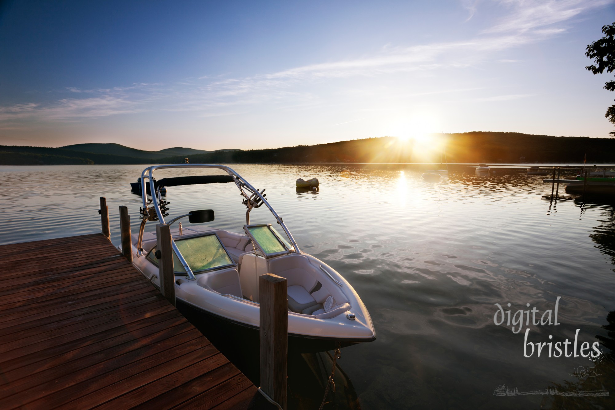 Boat docked on a calm lake in morning light