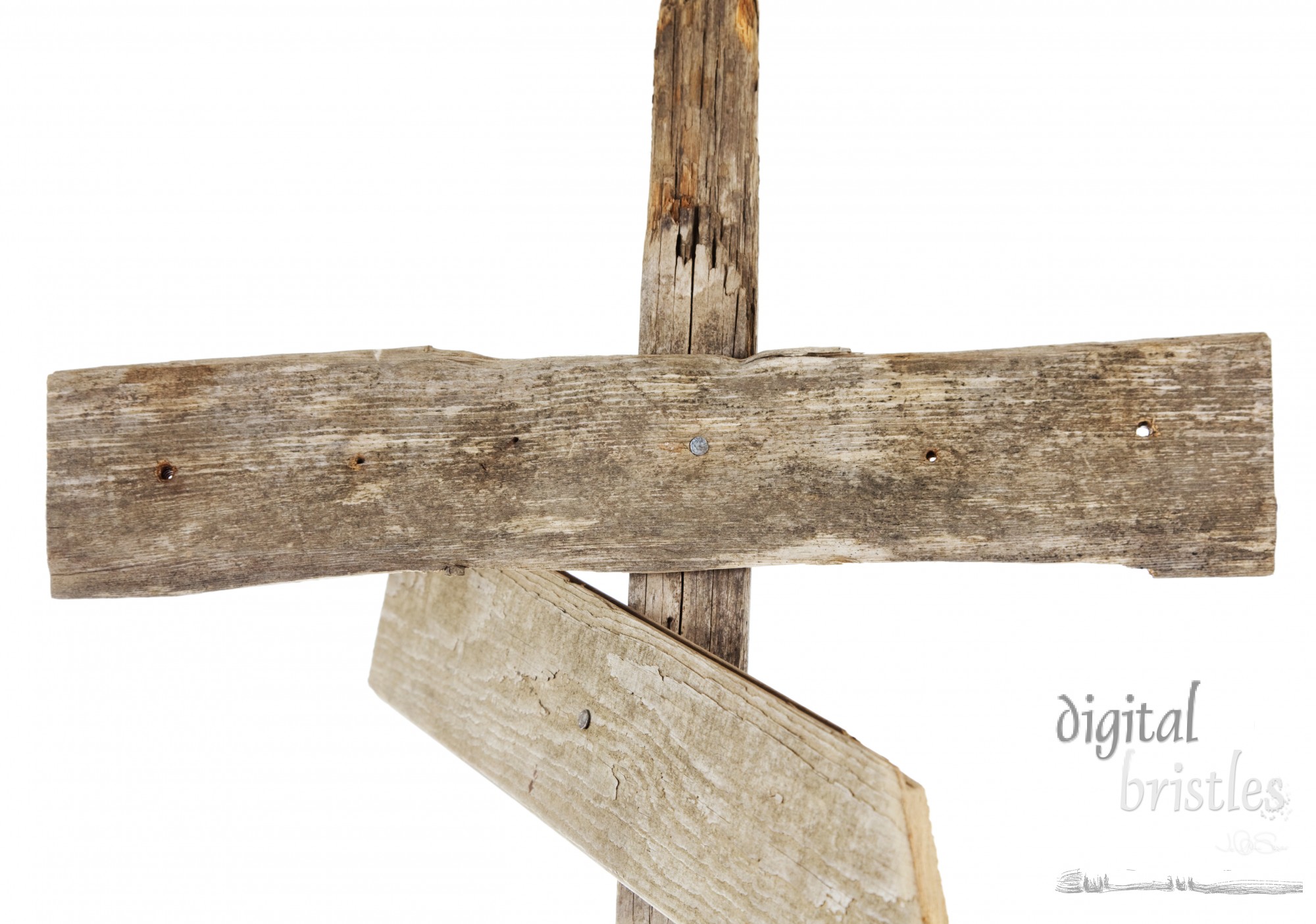 Rough hewn wood sign nailed to a post
