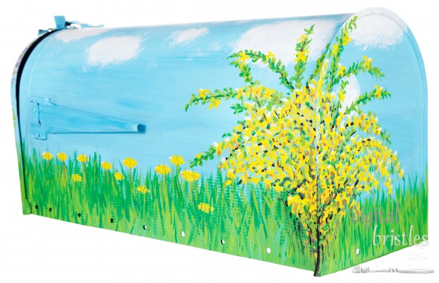Hand painted forsythia flowers, dandelions & grass on a mailbox