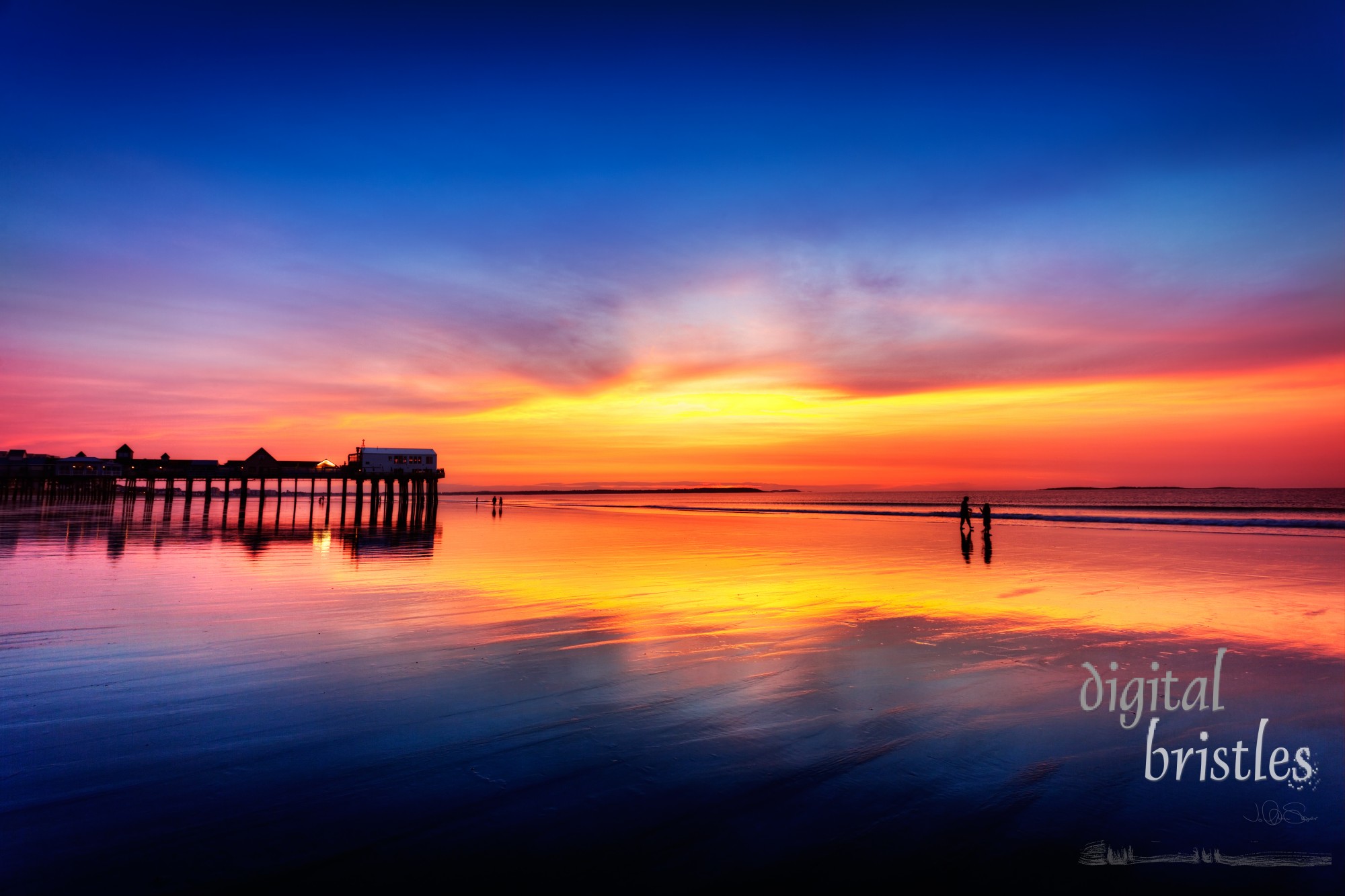 Pier at Old Orchard Beach, Maine, in vivid light before sunrise