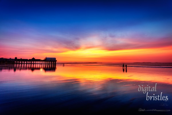 Pier at Old Orchard Beach, Maine, in vivid light before sunrise