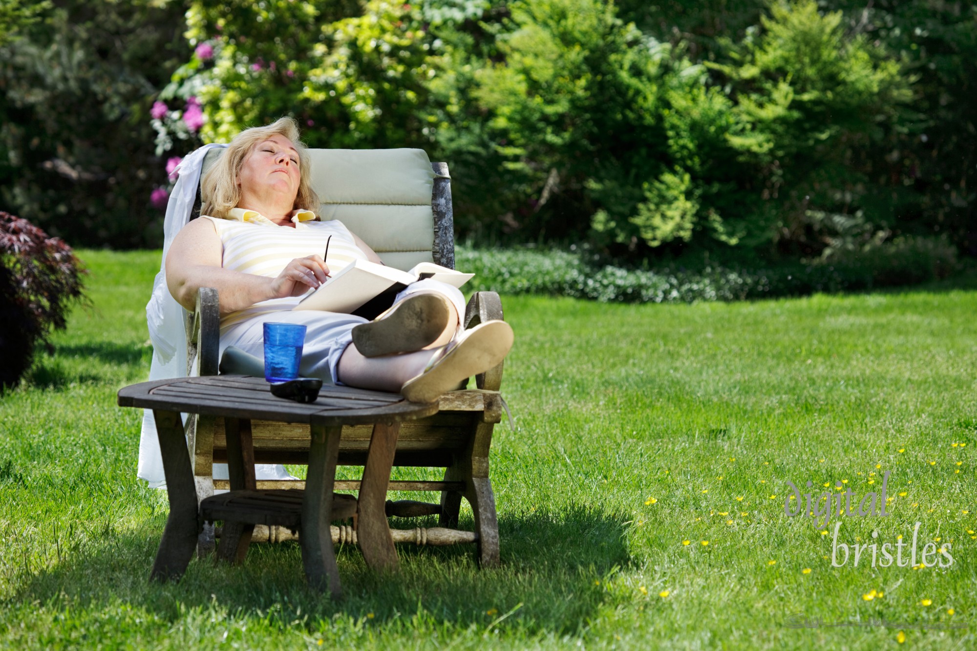 Mature woman napping in a garden chair