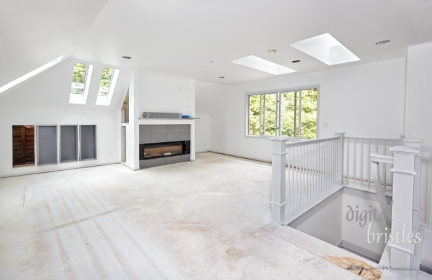 Walls and trim painted;  bookcases and media cabinets are being installed; fireplace assembled but not hooked up