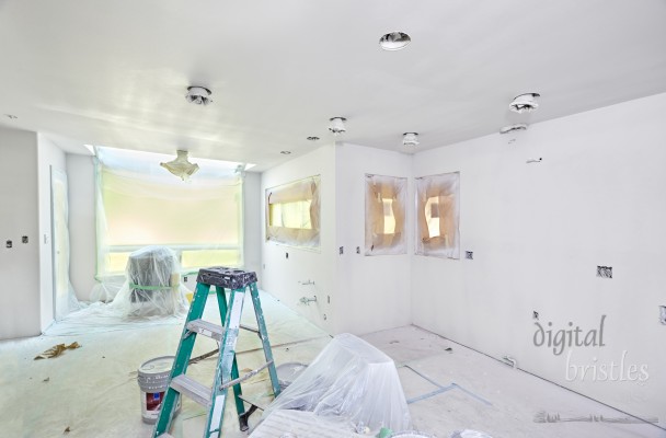 Kitchen wrapped and taped for spray painting the walls and ceiling